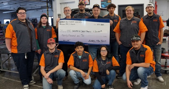 NRCA members Lin Hoskins (holding check left) and Brad Kernick (holding check right) pose with students in CCC’s auto body program following a $20,000 check presentation on Dec. 1 at CCC-Hastings. The funds are earmarked for the construction of an automotive careers training center.