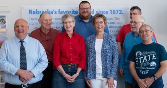 (Courtesy Grand Island Tourism) Eight volunteers and frontline workers were honored at a Grand Island Tourism open house. Honored were: (clockwise from the left), Doug Drudik, Nebraska State Fair; Ben Murphy, Fonner Park; Zack Mayhew, Heartland Public Shooting Park; Jeremy Millard, Heartland Public Shooting Park; Wayne Anson, Stuhr Museum; Doug Ostrander, Nebraska State Fair; Dianne Willey-Harms, Fonner Park/Heartland Events Center; and Jodi Fegley, Crane Trust Nature and Visitors Center